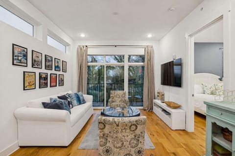 Living room features a pull out sofa, Smart TV, private patio, and more