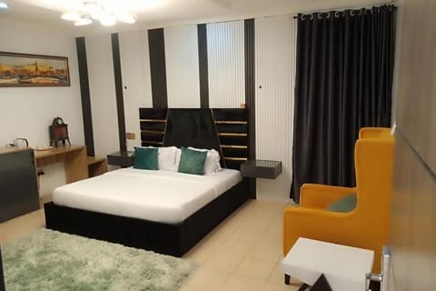 Economy Room, Balcony, City View | Desk, laptop workspace, blackout drapes, soundproofing
