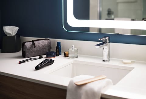 Combined shower/tub, hair dryer, towels, soap