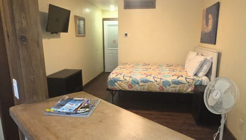 #109 is a studio with a queen bed, a full kitchen and a full bath.