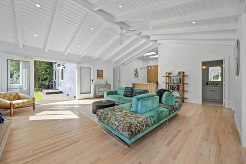 Living Room | Vaulted Ceilings & Teal Sofa