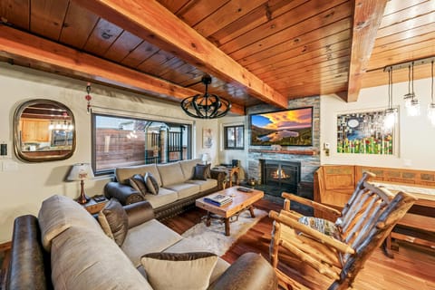 Cozy living room with rustic charm and mountain views