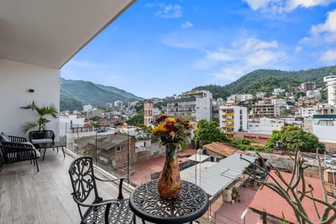 Breathtaking mountain and city panorama from your private balcony where morning coffee tastes even better.