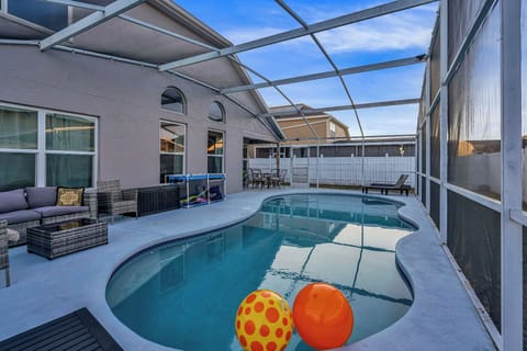 Private screened-in pool with spacious patio seating