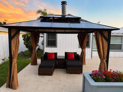 Charm backyard gazebo - covered roof, bug net, privacy curtains,  lounge seating