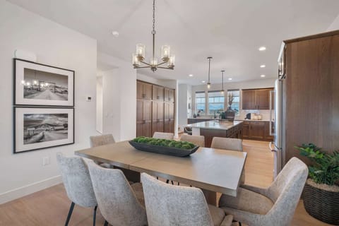 Dining Area: Dine with a backdrop. Gather for meals in this sleek, modern dining space where the majestic Bridger Mountains are the star of the show. Perfect for a memorable short break.