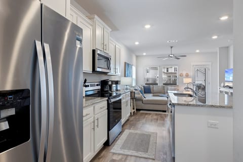 Serenity - 14330 Garden Glen by PKRM - Stainless appliances and huge kitchen island.
