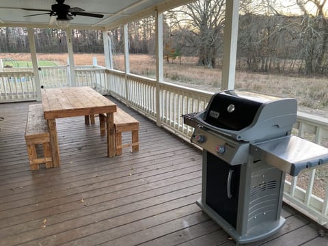 Back porch dining area with gas grill