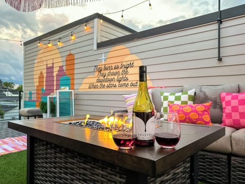 Rooftop Deck – Fourth Floor: Seating and firepit for relaxing