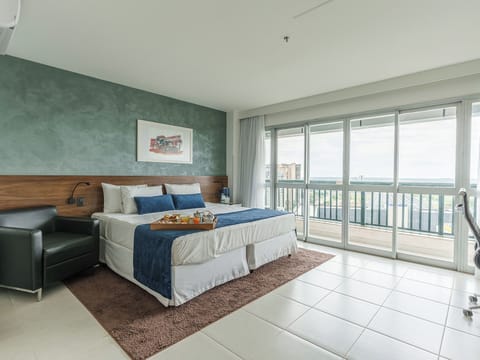 Deluxe Room (view) | Minibar, in-room safe, desk, laptop workspace
