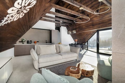 Relax in the stylish living room with a comfortable sofa and modern decor.