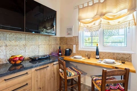 Fully equipped kitchen with wooden cabinets and modern appliances