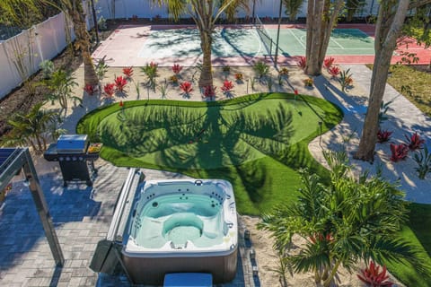 Outdoor Oasis: Enjoy the hot tub, sport courts, and lush landscaping in sunny Bradenton!