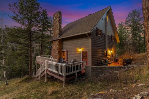 Your private forest escape with glowing evening charm and room to unwind indoors and out.