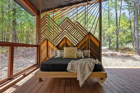 Handmade swing bed. A perfect spot to cuddle on the porch. 