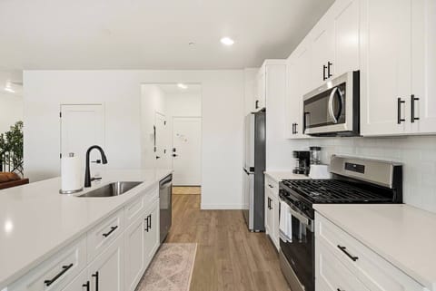 Bright, modern kitchen with stainless steel appliances and plenty of counter space.