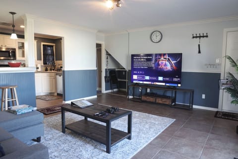 Premium entertainment setup with 75” Smart TV and retro gaming.