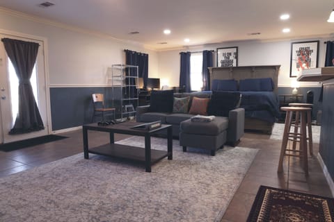 Spacious open layout with seamless flow between lounge, kitchen, and sleep area.
