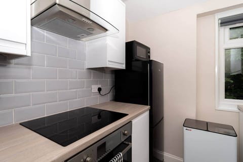 The kitchen has a contemporary and stylish aesthetic that seamlessly integrates with the overall ambience of the house. Clean lines, minimalist decor, and high-quality materials create an inviting space that is both visually striking and practical.