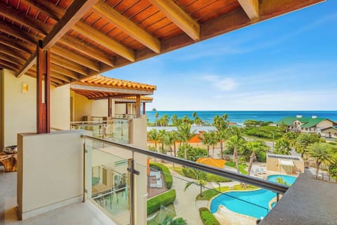 Step outside and take it all in—tropical gardens below, sparkling pool, and the ocean stretching out beyond. This balcony invites you to slow down, breathe in the sea air, and enjoy the view.