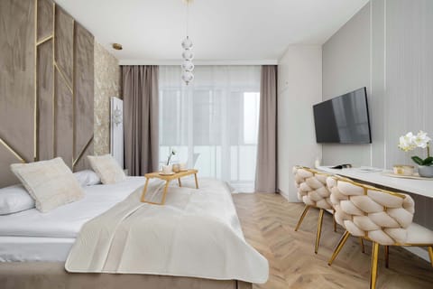 A bright, harmonious arrangement with soft fabrics and natural light creates an atmosphere that encourages relaxation and comfortable rest after a long day.