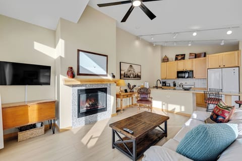 Cozy up by your crackling fireplace while enjoying modern amenities and thoughtful touches throughout this bright, open living space.