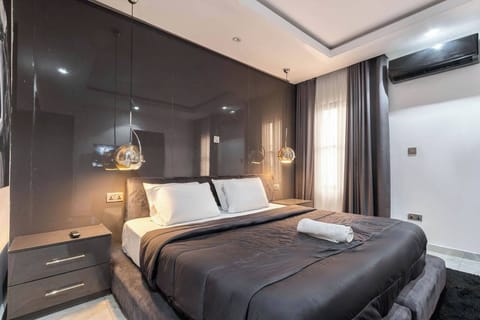 Family Apartment, Balcony, City View | Desk, laptop workspace, blackout drapes, soundproofing