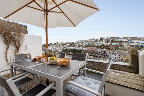 Sun terrace with dining table for 6 and stunning views over Brixham Harbour and out to sea