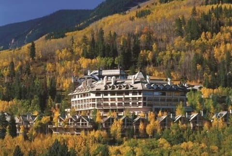Nestled among vibrant fall colors, this lodge blends elegance with nature's beauty.