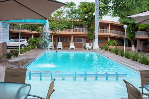 Outdoor pool, open 9:00 AM to 9:00 PM, free cabanas, pool umbrellas