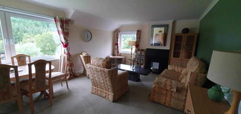 Lounge looking to River Black Water to the left and Ullapool straight ahead 