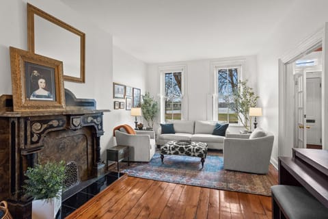 Living Room | Decorative Fireplace | Natural Light | Elegant Seating | River Views