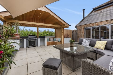 built-in outdoor kitchen, complete with gas BBQ and wood fired pizza oven