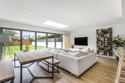 Dining and living area with garden views