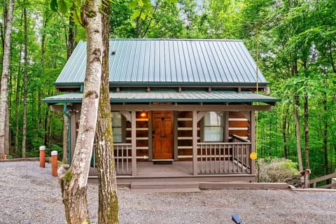 Simple, authentic, and surrounded by forest, this front view captures the timeless charm of a true log cabin getaway.