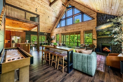 Towering windows, vaulted ceilings, and an open layout create a bright, welcoming space where mountain views and unforgettable moments take center stage.
