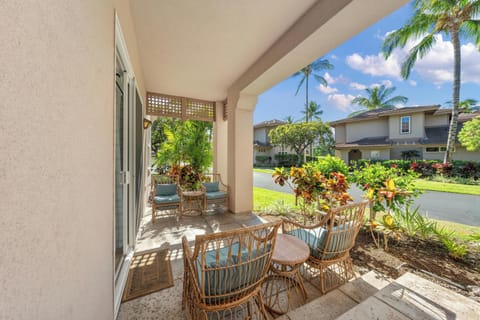 Relax on your covered patio with tropical garden views and charming seating for peaceful mornings or evening gatherings.