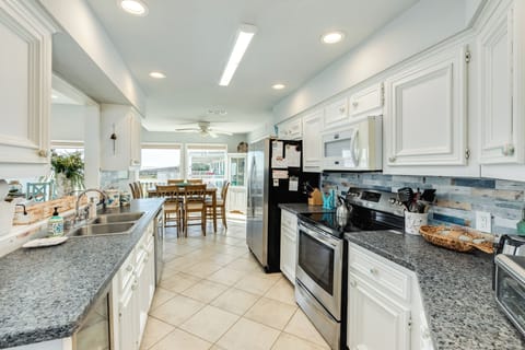 Cook with ease in your spacious, fully-equipped kitchen featuring granite countertops, stainless steel appliances