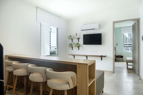 Open kitchen with dining bar and stools.