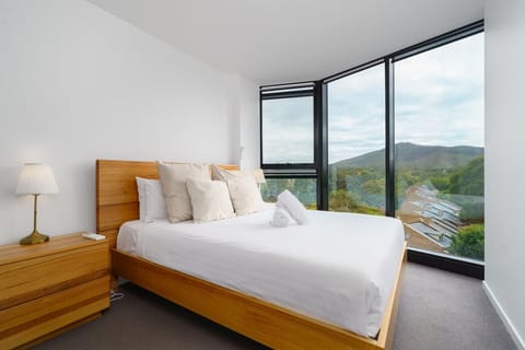 Wake up to beautiful views and natural light in this calm, comfortable bedroom, complete with quality linen for a restful night’s sleep.