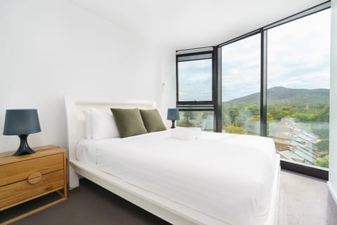 Wake up to natural light and beautiful views from this calm, cosy bedroom. A peaceful space designed for rest and relaxation.