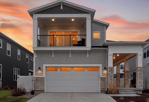 Modern Park City getaway with sunset glow, private balcony, and covered entry—your mountain basecamp for year-round adventure.