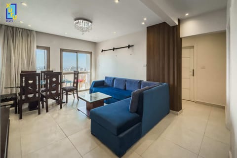 Basic Apartment | Living area | 55-inch TV with satellite channels