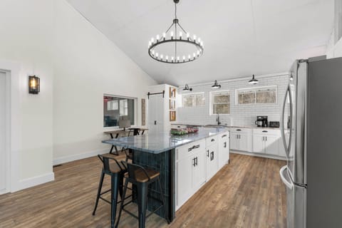 Kitchen island has seating for 7.