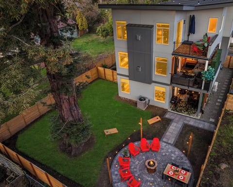 Unwind in this stunning backyard retreat! Enjoy cozy nights around the firepit.