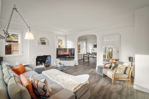 Bright living room with classic archways 