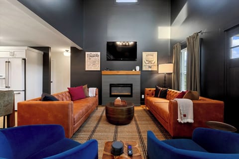 Comfortable sofas and seating in the Living Area with electric fireplace and 55" Smart TV