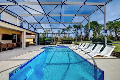 POOL AREA:  Private Screened Northeast Facing Swimming Pool & Spa with 6 In-Pool Ledge Loungers