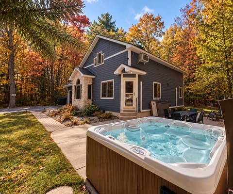 Private forest retreat with hot tub, patio dining, and stunning fall colors