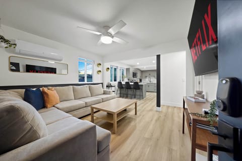 Bright modern living room with smart TV – perfect for relaxing stays
